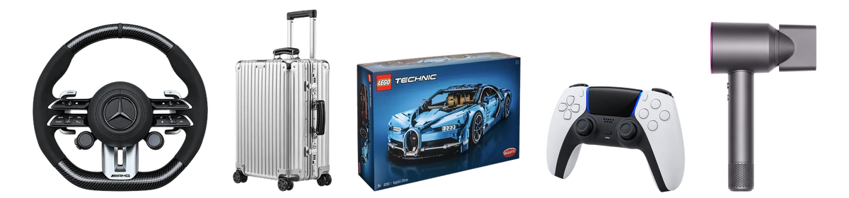 Volante, valigia in alluminio, set LEGO Technic, controller gaming e asciugacapelli